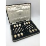 A Set of Sheffield silver tea spoons and sugar tongs within a fitted box. Makers Cooper Brothers &