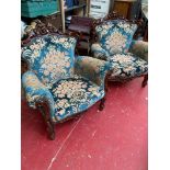 Two reproduction French style lounge chairs.