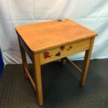 A Vintage children's school desk with lift up top. Has Original Aluminium ink pot with cover.