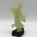 A Chinese hand carved Jade Geisha figurine sat upon a hardwood stand.