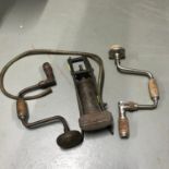 A Vintage Vauxhall car pump and two vintage hand drills [One Named Stanley]