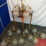 A Collection of vintage brass and glass globe shade wall lights and matching 5 branch chandelier
