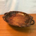 Antique Black Forest hand carved fruit bowl detailing grapes and foliage. Has music box built in.