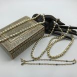 A Lot of four vintage pearl necklaces with silver clasps. Together with a vintage Mosaic jewel box.