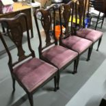 A set of four early 1900's high back dining chairs