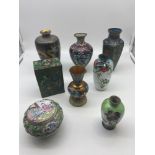 8 pieces of 19th century and early 20th century Chinese Cloisonne vases and lidded pots.