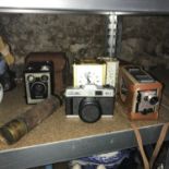 A Lot of vintage cameras, carriage clocks [battery] and three draw pull scope [no signatures]