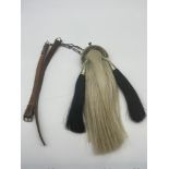 Antique horse hair small sporran. Designed with a plated engraved top, two tassels, green leather