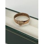 A Birmingham 9ct gold band ring, designed with a heart shape engraved with Initials. Ring size P. [