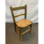 Antique child's oak chair.