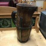 Antique wood and metal bound wine jug. Measures 35cm in height
