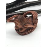 A Japanese hand carved netsuke figure of a mermaid, signed to the base by the artist.