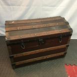 Antique saratoga travel trunk. Designed with wooden bounds.