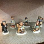 A Lot of 6 vintage/Antique Hummel Goebel figures, To include boy and horse, Boy and Girl sitting