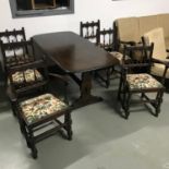 A vintage Ercol elm wood dining table with four chairs and two carvers. Very good condition. Table