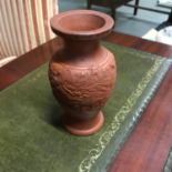 A 20th century Chinese dragon design terracotta vase, Measures 14cm in height