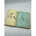 A 1920's Album containing a collection of art works and sayings by The original owner and various