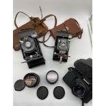 A Lot of vintage cameras which includes Contessa Nettel bellow camera, Kodak No.1 Pocket Kodak