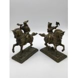 A Pair of 20th century brass horse back figures. Measure 18cm in height.