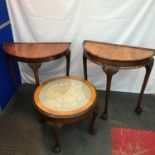 Two antique half moon hall tables together with an antique small round table with tapestry and glass