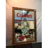 A Vintage Coleman's Mustard advertising mirror, Fitted within a pine frame. Measures 91x65cm