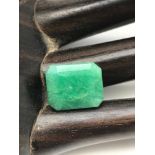 A 1950'S man made Emerald gem stone. Measures 1.3x1.1x0.6cm