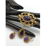 A Beautiful Antique 9ct gold and amethyst brooch with matching earrings. Gems tested by presidium