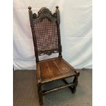 A 16th century high back cottage chair, designed with carved panels and hand turned finials. Bergere
