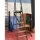 A Large set of vintage wooden trestle ladders.