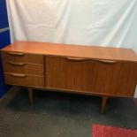 A Retro mid century A.H. McIntosh & Co Ltd Kirkcaldy Scotland teak pedestal sideboard designed