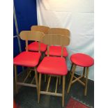 A Set of four contemporary bar stools with red leather upholstery and one other. All produced by