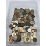 A Tub containing a quantity of mixed world coins.