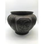 A 19th century Chinese Bronze planter. Detailed with raised relief panels showing various birds