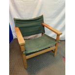A Retro light wood and green canvas relaxer chair.
