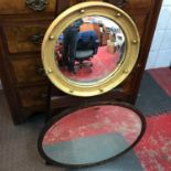 Art Deco convex gilt frame mirror together with an oak framed oval bevel edge mirror.