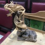 A Piece of drift wood designed with a clay pottery dragon. [41cm in height]