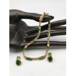 A 14ct gold and Jade/Jadeite gem stone bracelet with matching earrings. Weighs 12.94grams.