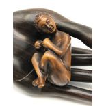 A Japanese hand carved netsuke figure of a nude Geisha girl. Signed to the base by the artist.