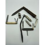 A Lot of antique and vintage whistles and pocket knives, to include 1940 Hudson and co whistle