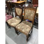 A lot of two Victorian oak 'his & her' parlour chairs, with matching upholstery & ceramic castors