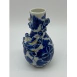 A 19th century Qing Dynasty blue and white dragon design vase. [9.5cm in height]