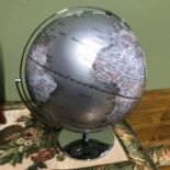 A Contemporary silver designed desk globe. [38cm in height]