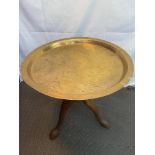 A 19th century large Chinese engraved brass table top plate, Together with a hand carved tri-leg