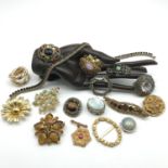 A Box containing a quantity of Vintage costume brooches to include Silver leaf brooch and ornate