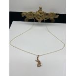 A 9ct gold rabbit pendant with a 9ct gold necklace. [Weighs 1.53 grams] [16 inch chain]