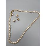 A ladies vintage pearl necklace designed with a 9ct gold clasp together with two pairs of 9ct gold