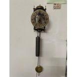 A Vintage Tempus Fugit skeleton wall clock with weight and pendulum.