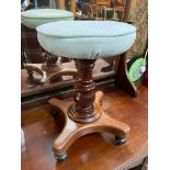 A Victorian rise and fall single pedestal piano stool.