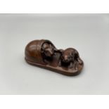 Japanese hand carved netsuke of a pair of mice hiding within a slipper, signed by the artist [6cm