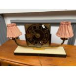 An original Art deco mantel clock designed on a marble base clock is made of a glass panel then